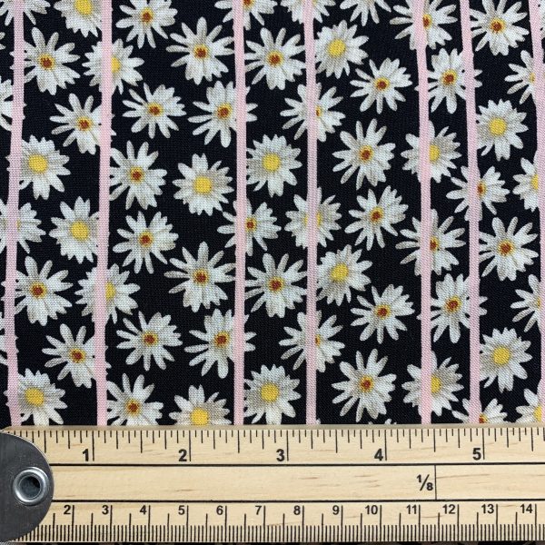 black viscose with daisy print with ruler